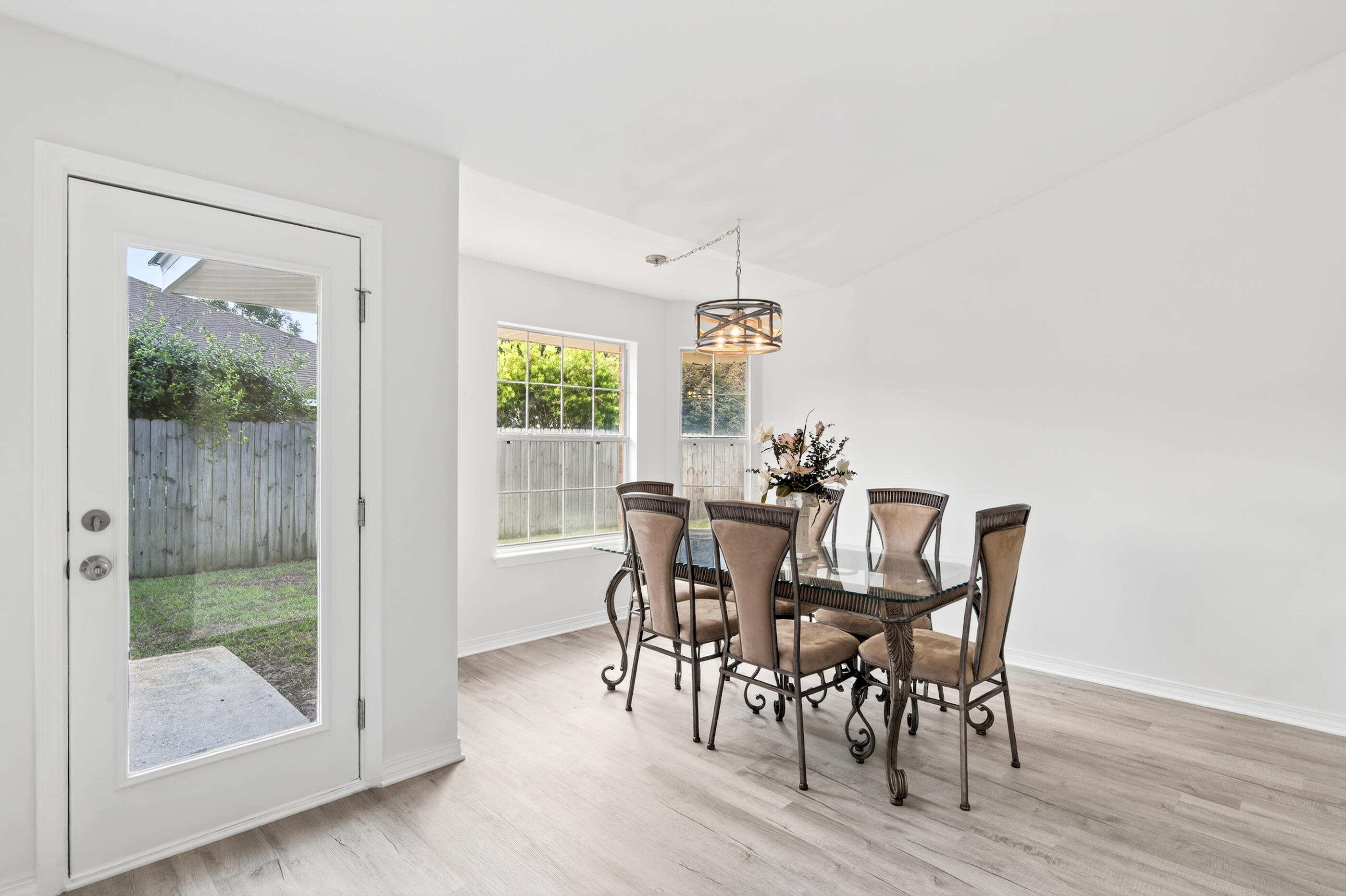 151 Beacon Way Miramar Beach, FL 32550 - Photo 17 of 42 a view of a dining room with furniture and wooden floor