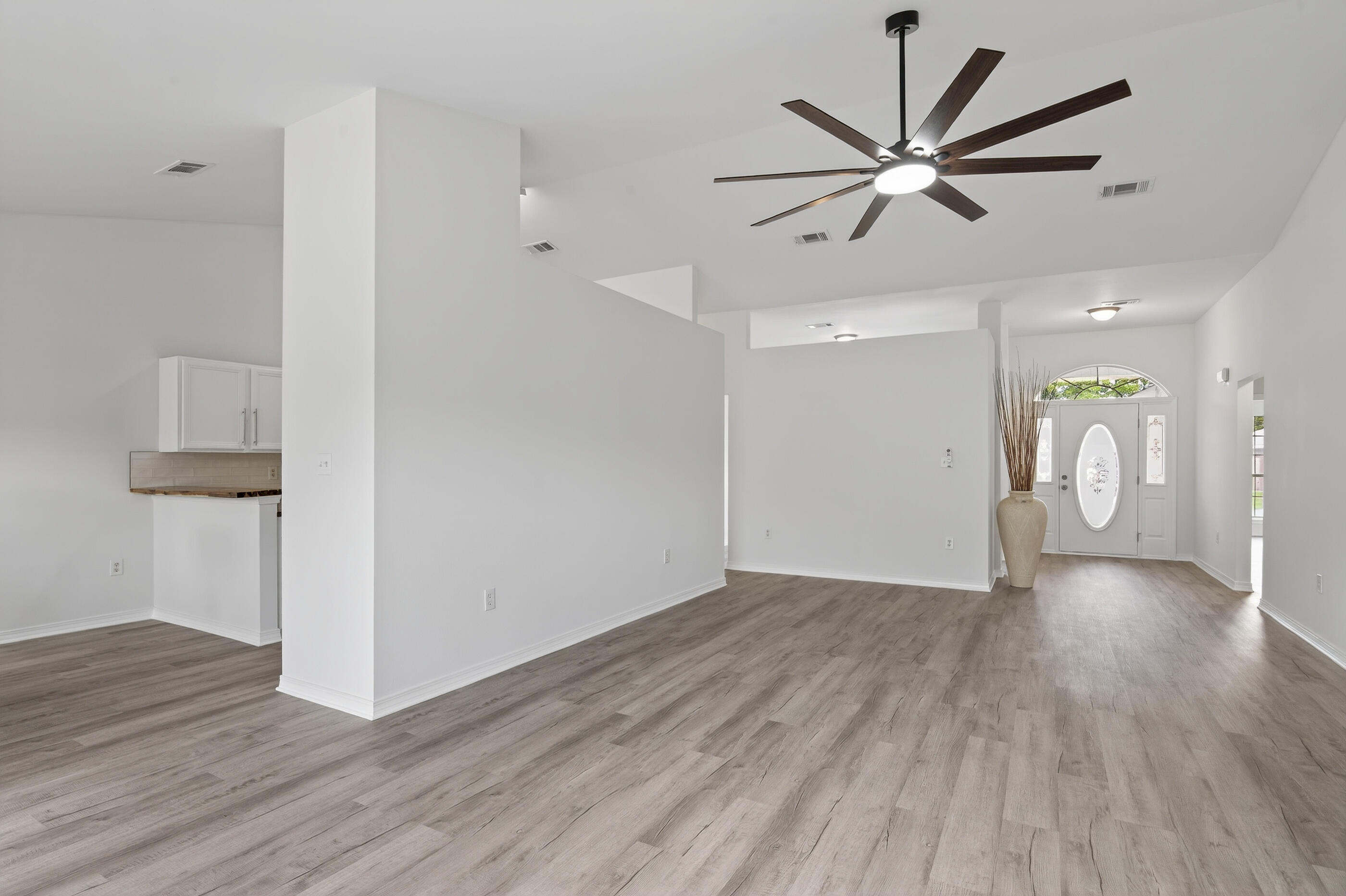 151 Beacon Way Miramar Beach, FL 32550 - Photo 19 of 42 a view of an empty room and wooden floor