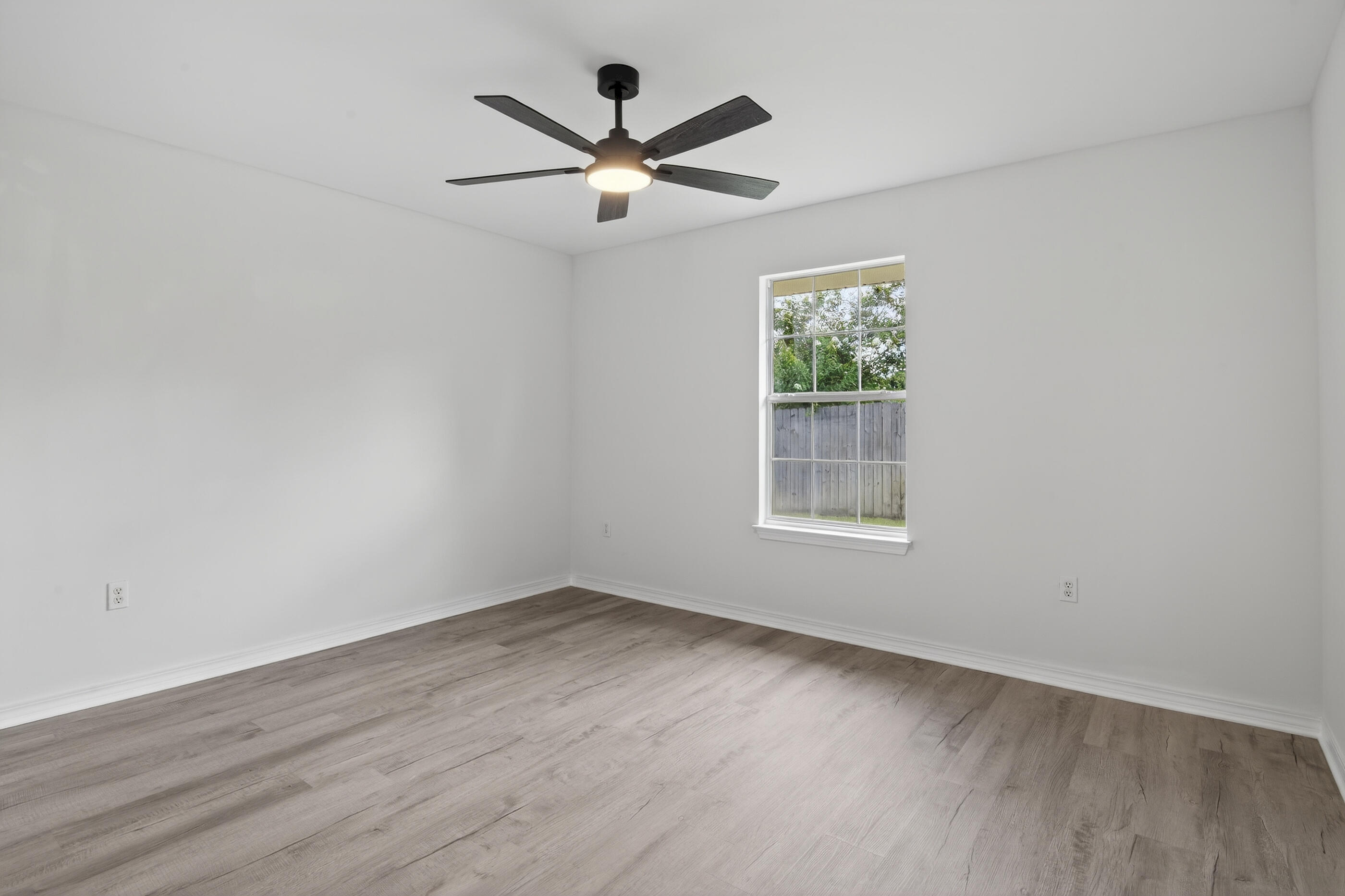 151 Beacon Way Miramar Beach, FL 32550 - Photo 29 of 42 wooden floor in an empty room with a window