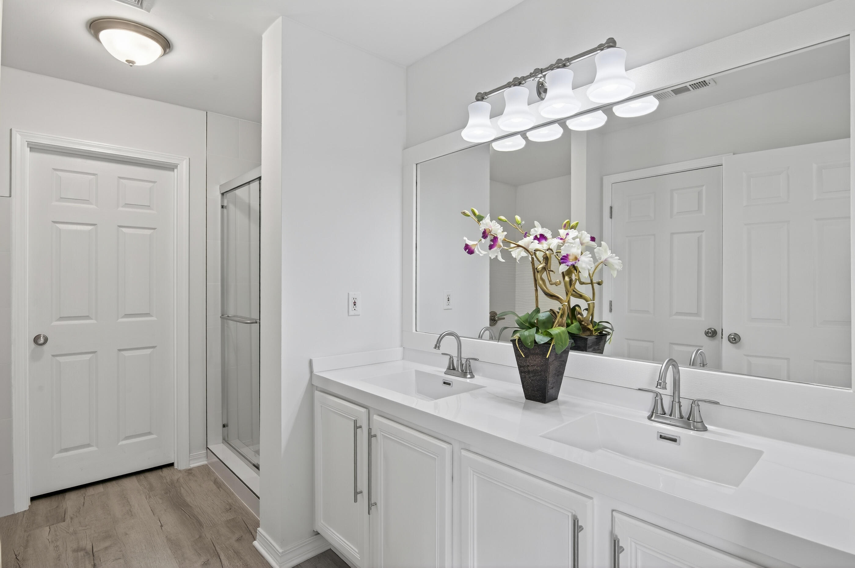 151 Beacon Way Miramar Beach, FL 32550 - Photo 9 of 42 a bathroom with a sink vanity and a mirror