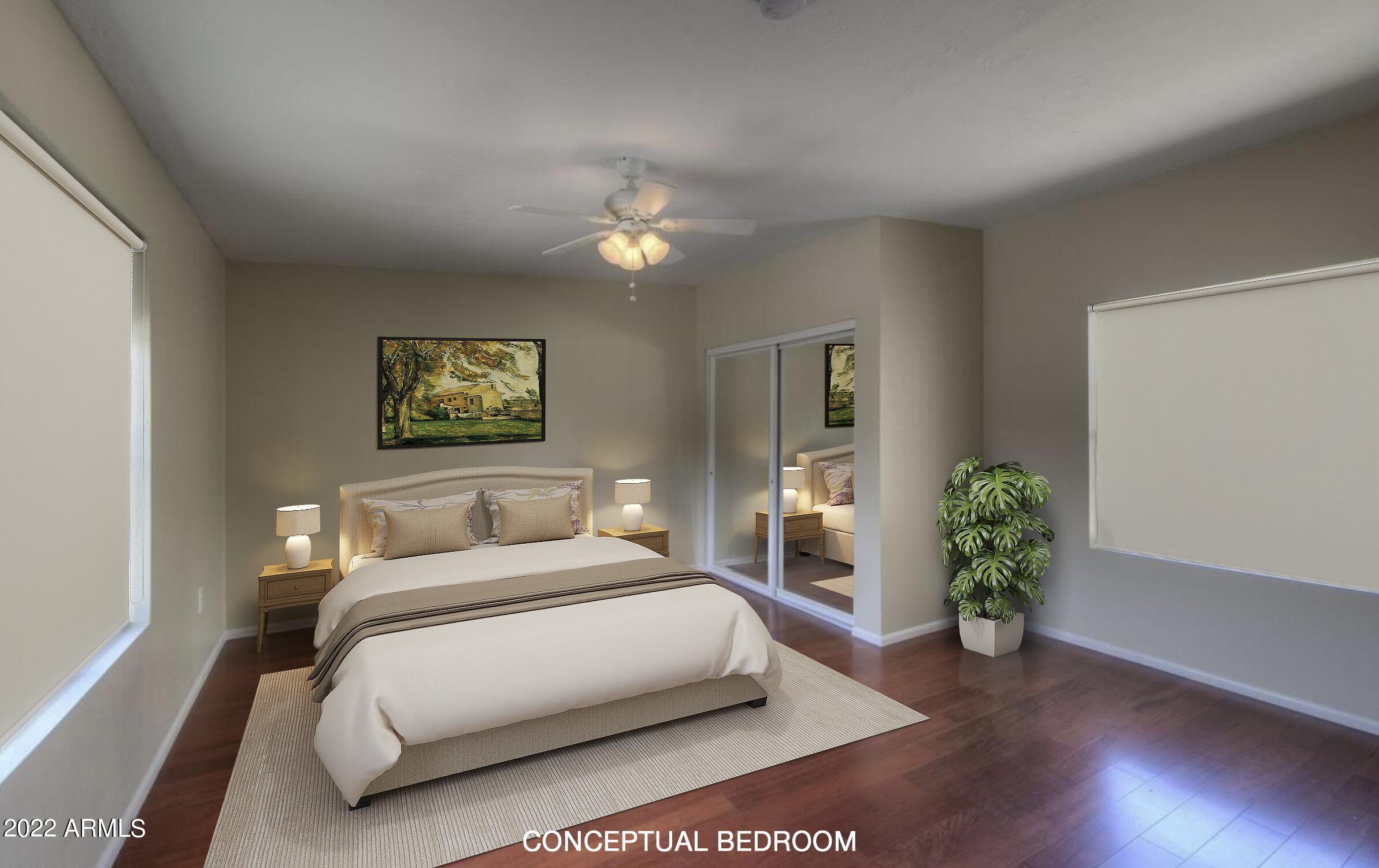 6609 East Phelps Road Scottsdale, AZ 85254 - Photo 60 of 83 a bedroom with a large bed and a potted plant