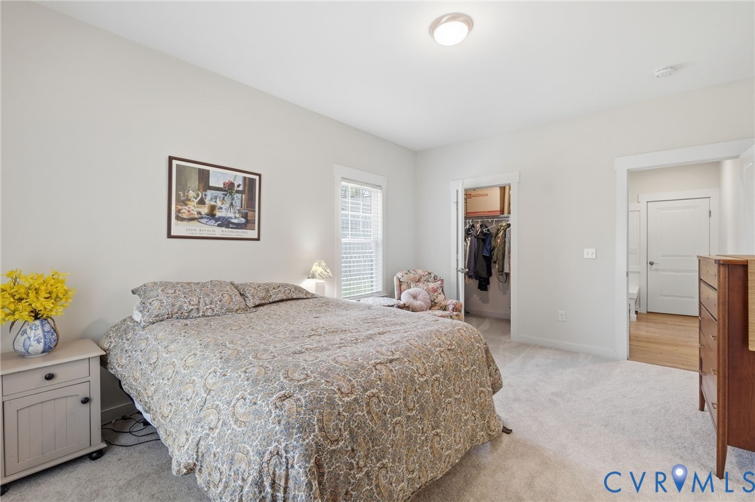 605 Carldan Road Richmond, VA 23227 - Photo 15 of 38 a bedroom with a bed and a cabinets
