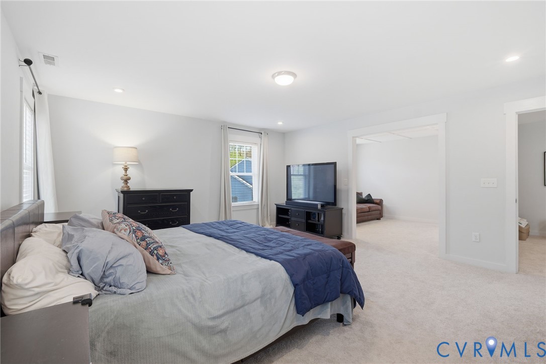 605 Carldan Road Richmond, VA 23227 - Photo 18 of 38 a bedroom with a bed and a television