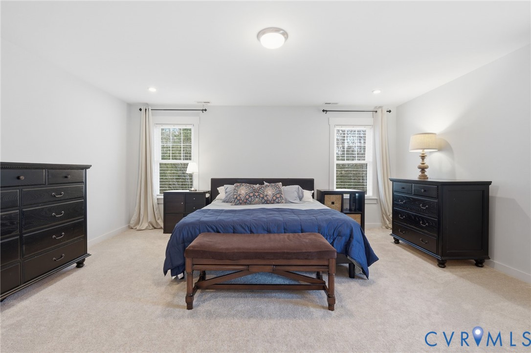605 Carldan Road Richmond, VA 23227 - Photo 19 of 38 a bedroom with a bed and a dresser