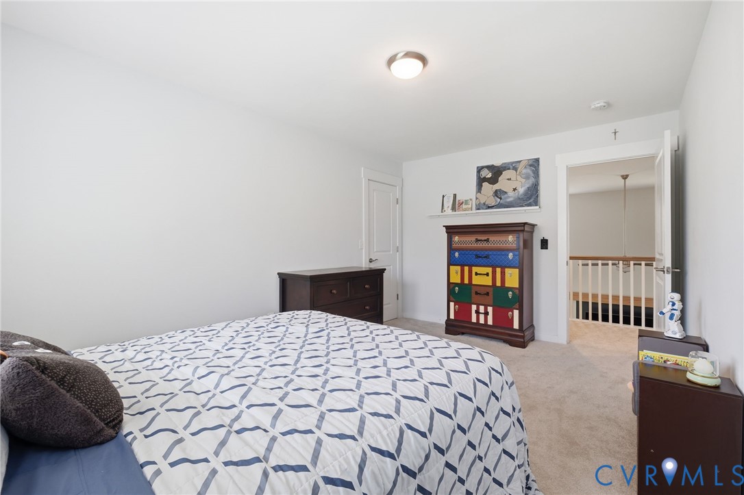 605 Carldan Road Richmond, VA 23227 - Photo 21 of 38 a bedroom with a bed and dresser