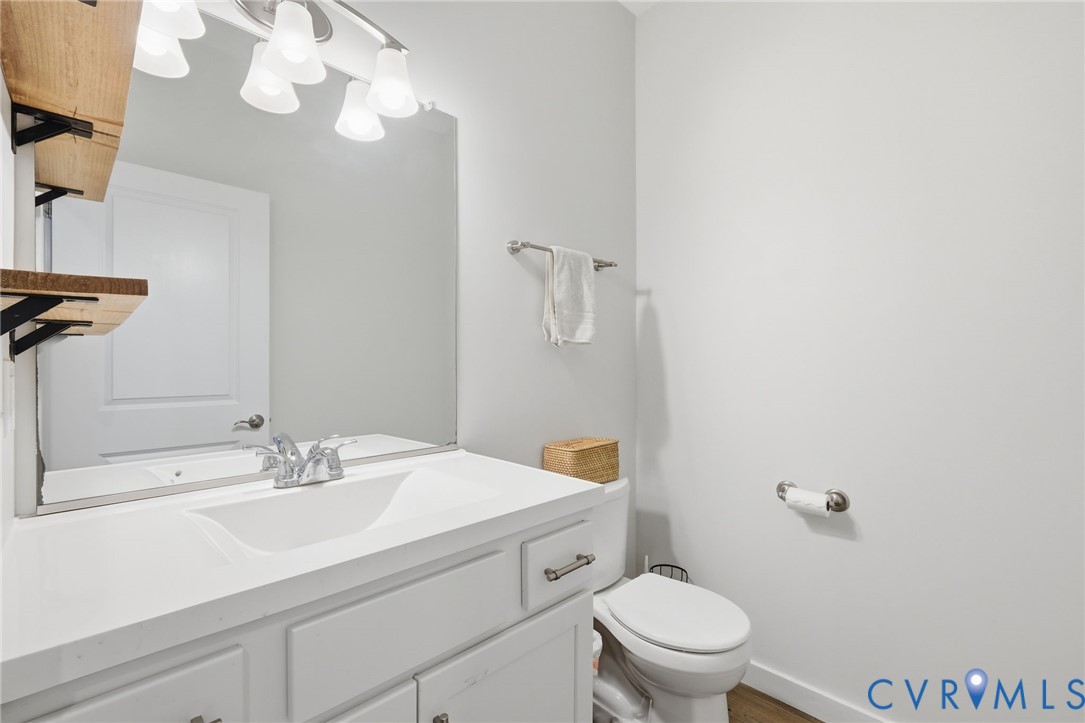 605 Carldan Road Richmond, VA 23227 - Photo 24 of 38 a bathroom with a sink a toilet and a mirror