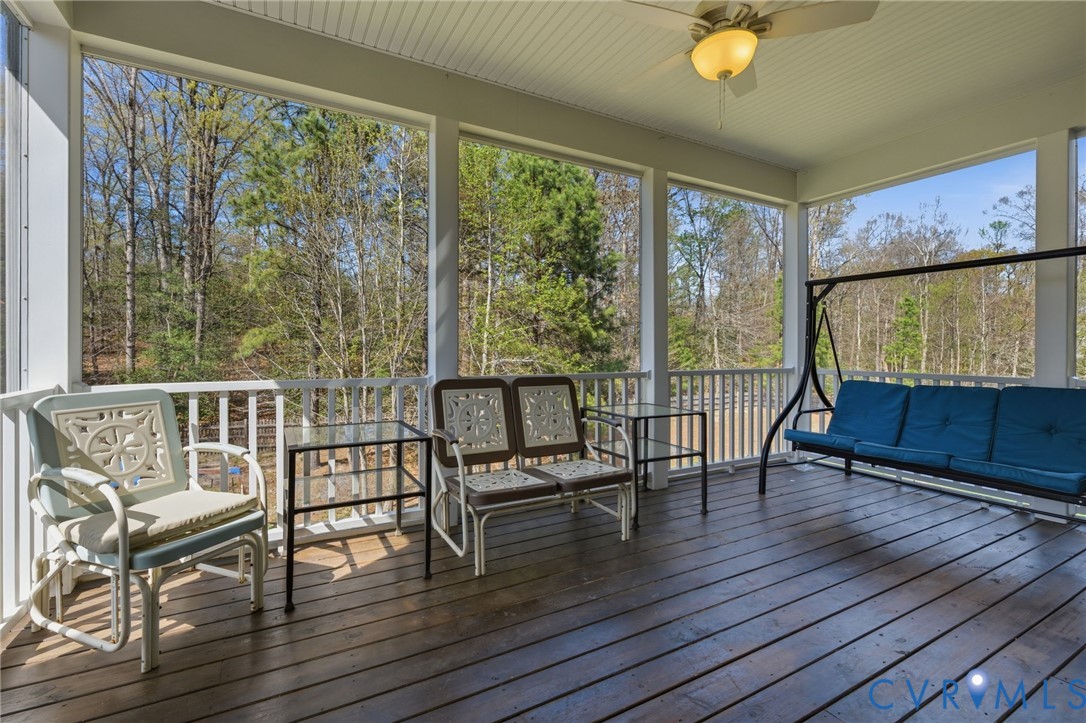 605 Carldan Road Richmond, VA 23227 - Photo 32 of 38 a view of a porch with furniture and wooden floor
