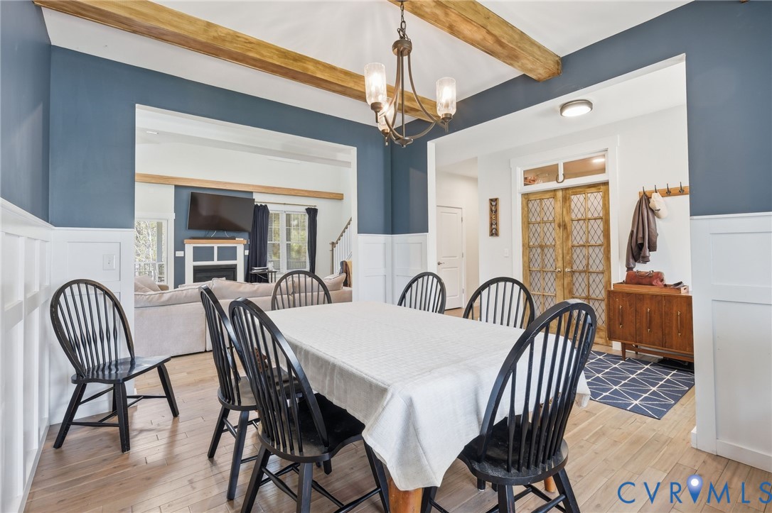 605 Carldan Road Richmond, VA 23227 - Photo 9 of 38 a view of a dining room with furniture window and wooden floor