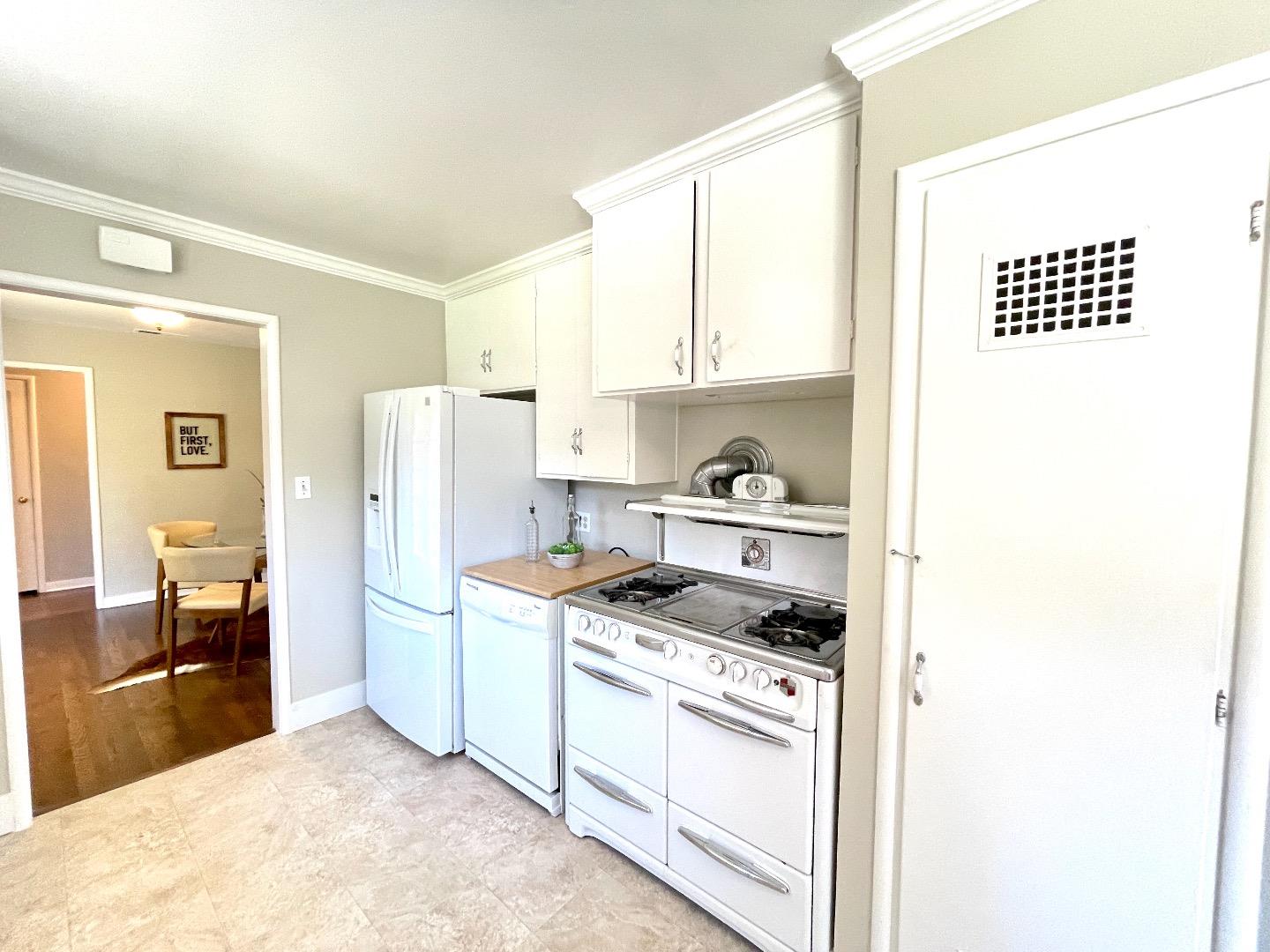 2516 Bailey Avenue San Jose, CA 95128 - Photo 11 of 54 a kitchen with stainless steel appliances granite countertop a refrigerator and a stove