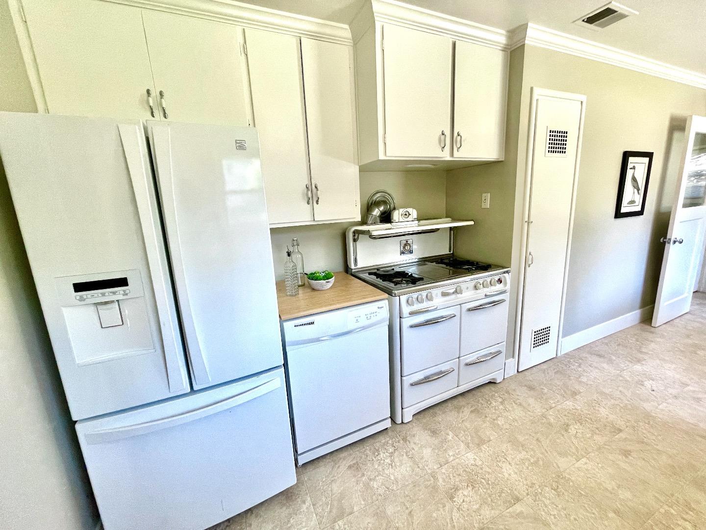 2516 Bailey Avenue San Jose, CA 95128 - Photo 13 of 54 a kitchen with white cabinets and white appliances