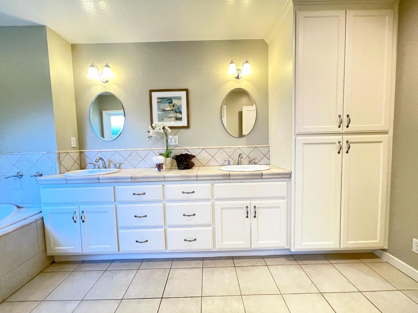 2516 Bailey Avenue San Jose, CA 95128 - Photo 21 of 54 a bathroom with a double vanity sink and a mirror