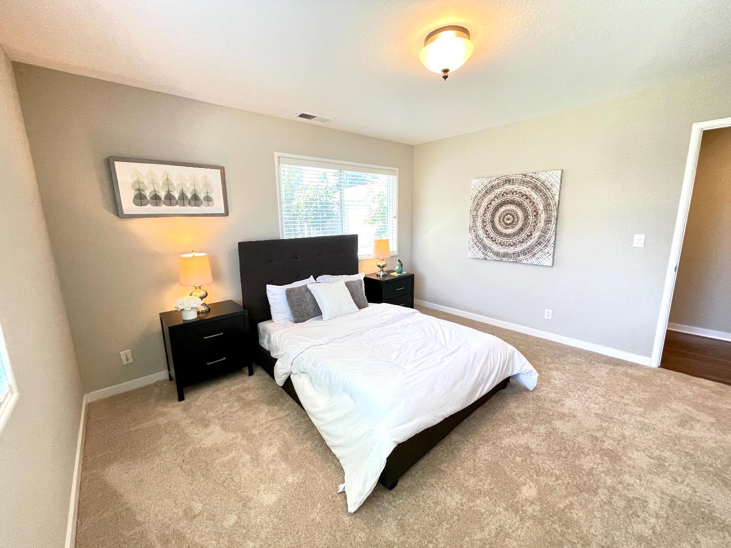 2516 Bailey Avenue San Jose, CA 95128 - Photo 28 of 54 a bedroom with a bed and a painting on the wall