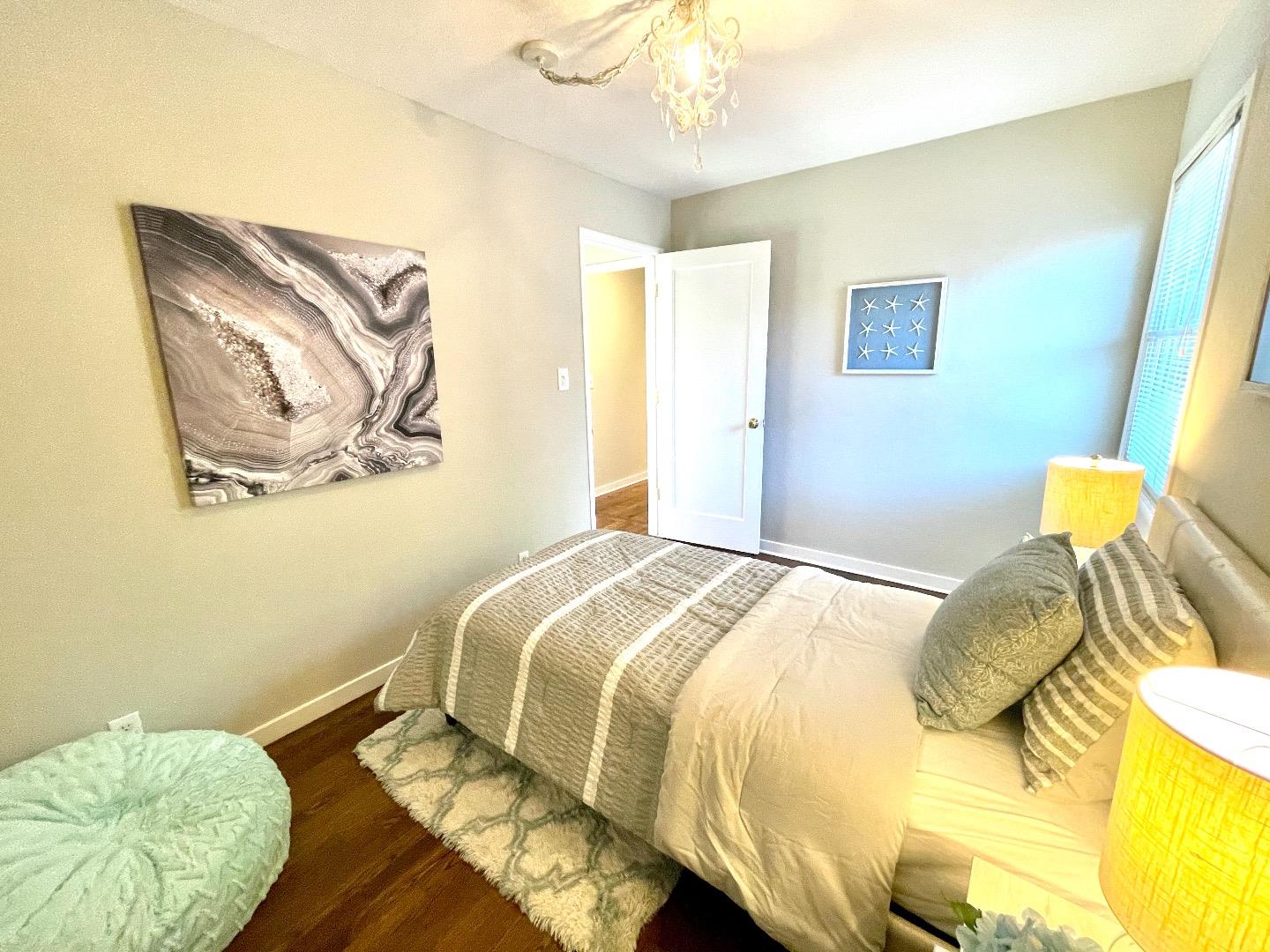 2516 Bailey Avenue San Jose, CA 95128 - Photo 37 of 54 a bedroom with a bed and a painting on the wall