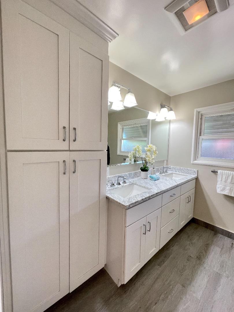 2516 Bailey Avenue San Jose, CA 95128 - Photo 39 of 54 a bathroom with a granite countertop sink and a mirror