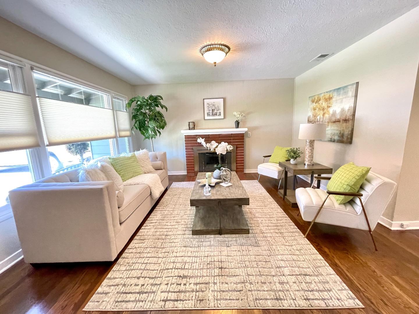 2516 Bailey Avenue San Jose, CA 95128 - Photo 5 of 54 a living room with furniture and a fireplace