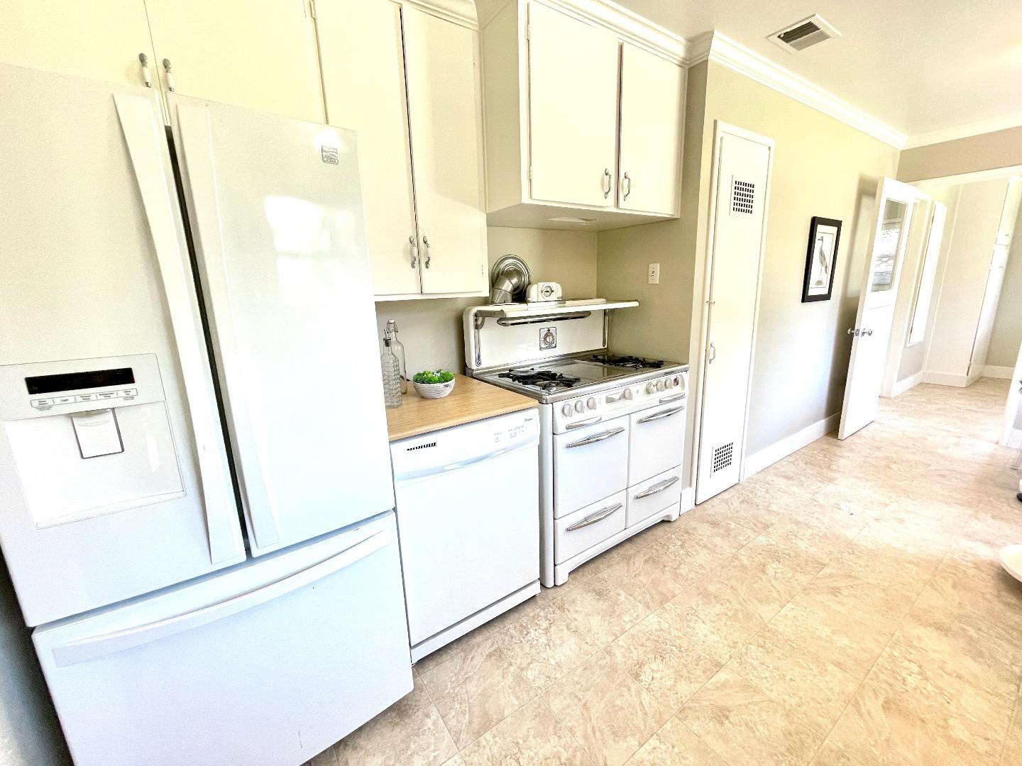 2516 Bailey Avenue San Jose, CA 95128 - Photo 10 of 54 a kitchen with stainless steel appliances a refrigerator a sink a stove a microwave a counter top and a cabinets