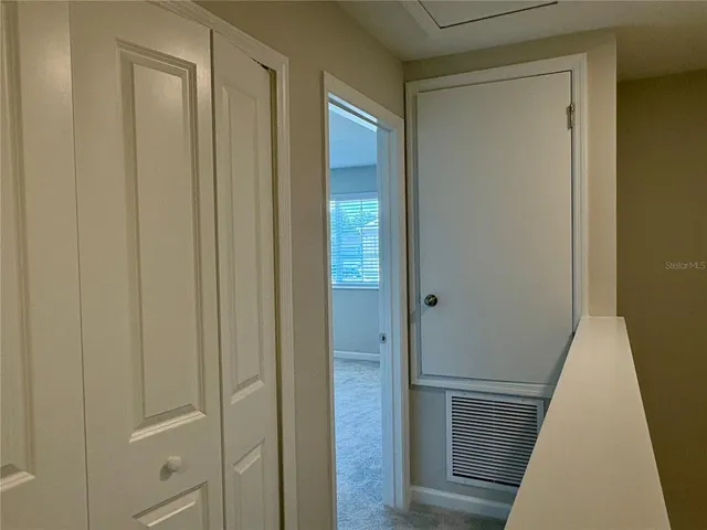 a bathroom with a granite countertop bathtub shower sink vanity and toilet