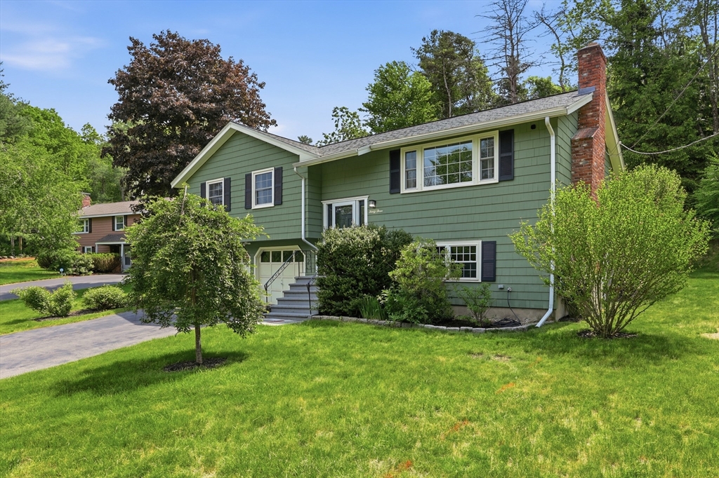 33 Simon Willard Road Acton, MA 01720 - Photo 2 of 42 a view of a house with a yard and plants