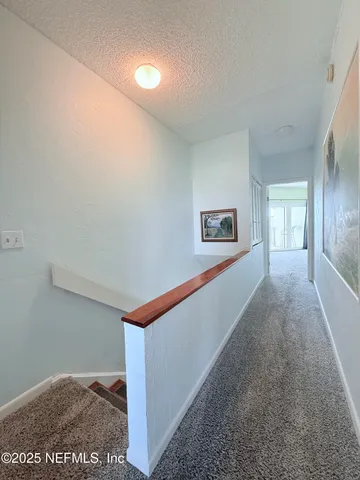 a view of a hallway with an empty room