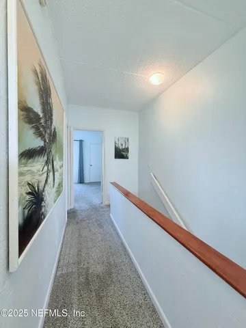 a view of hallway with stairs