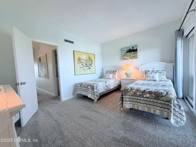 a bedroom with a bed and a table in it