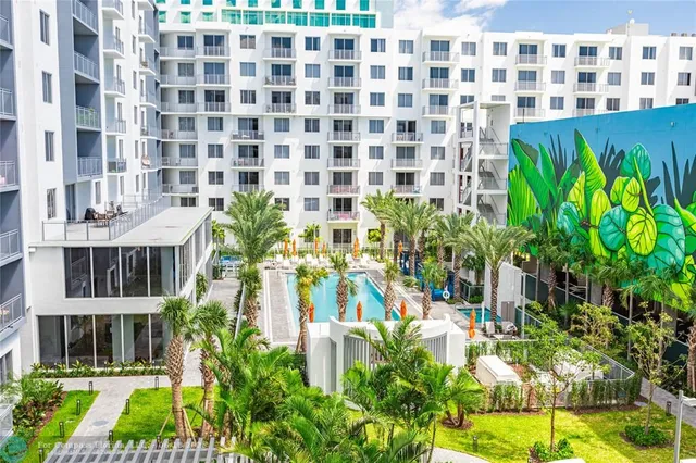 a view of a swimming pool with a patio