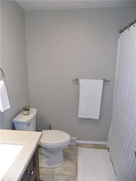 226 Eighty Acres Road Dunbar, PA 15431 - Photo 13 of 26 a bathroom with a toilet a sink and mirror