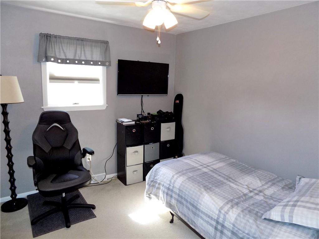 226 Eighty Acres Road Dunbar, PA 15431 - Photo 19 of 26 a bedroom with a bed and a flat screen tv