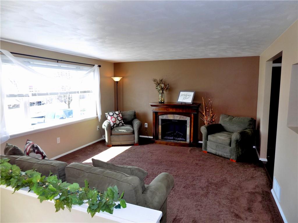 226 Eighty Acres Road Dunbar, PA 15431 - Photo 7 of 26 a living room with furniture and a fireplace