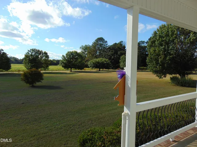 a kitchen with white cabinets and sink