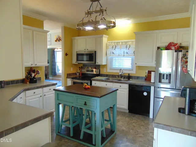 a view of a room with gym equipment and windows