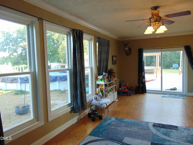 a dining room with furniture and chandelier