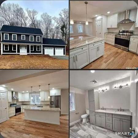 a kitchen with stainless steel appliances kitchen island granite countertop a sink and cabinets