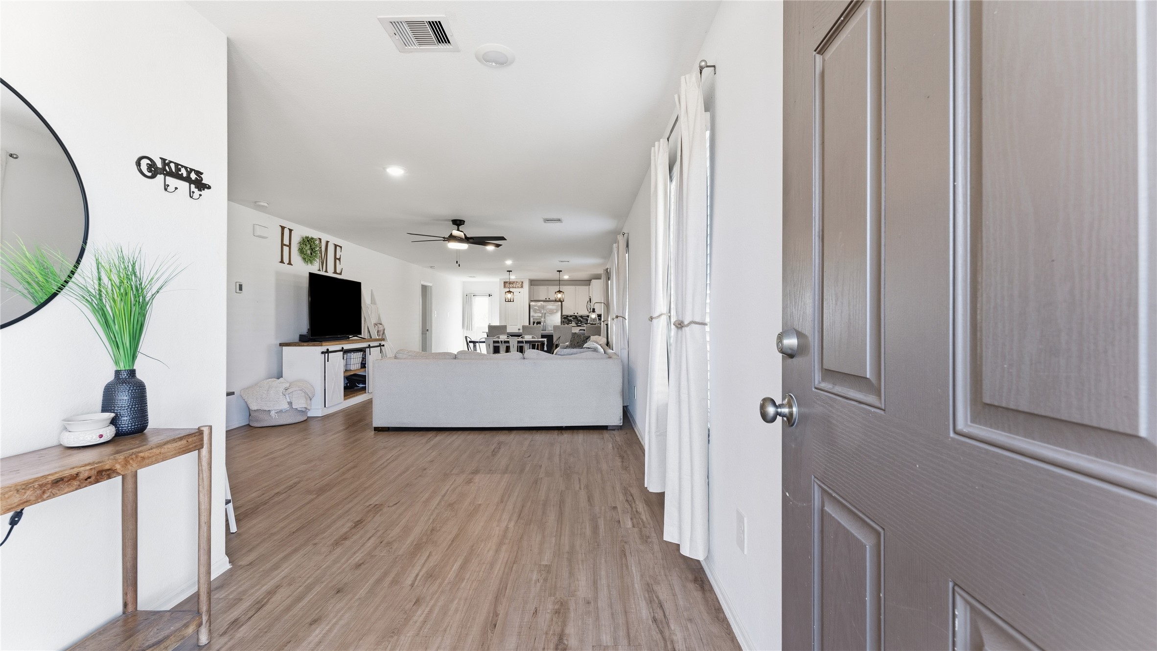 126 Spring Rose Drive Magnolia, TX 77354 - Photo 13 of 48 a view of a living room and a flat screen tv