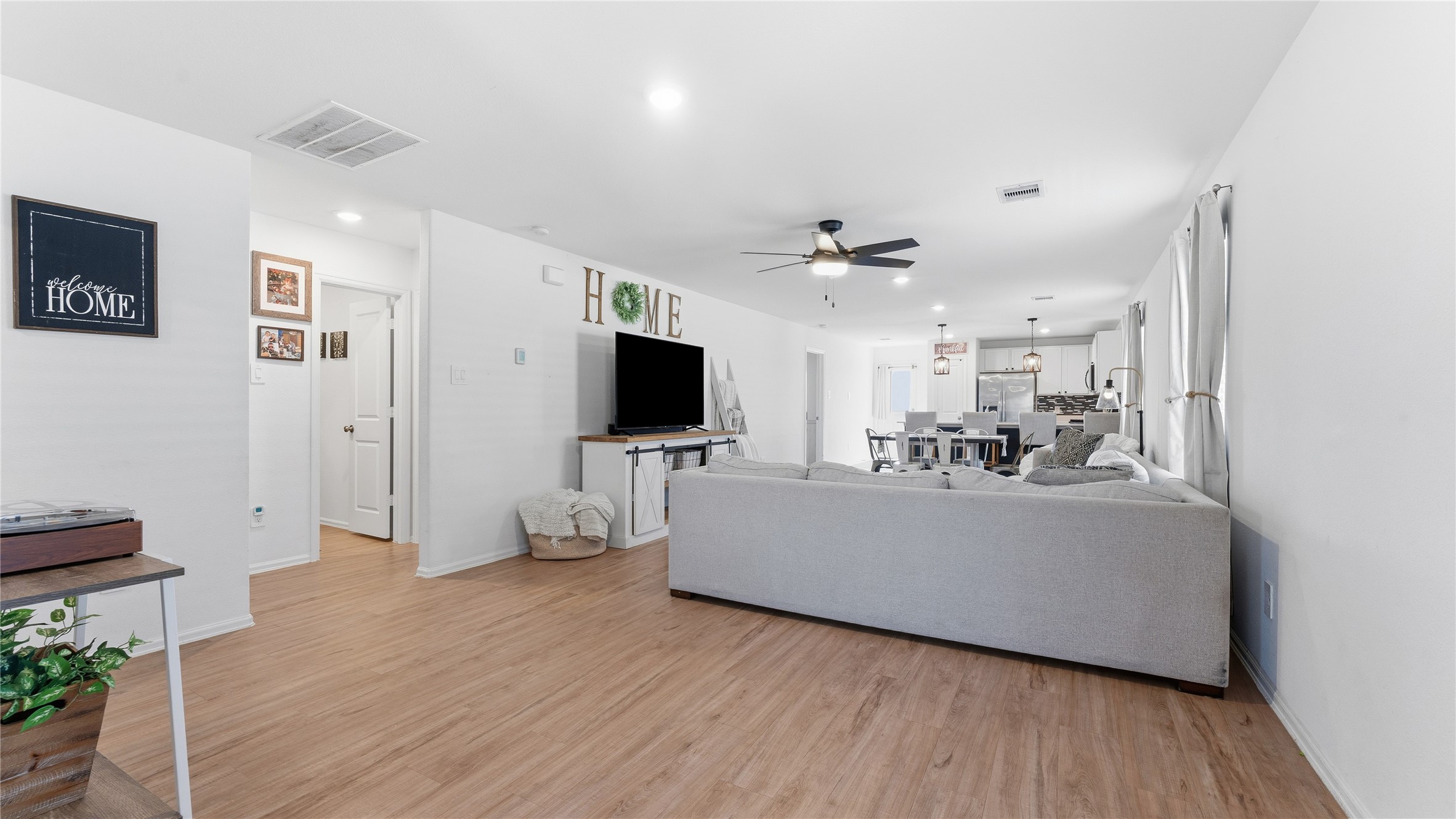 126 Spring Rose Drive Magnolia, TX 77354 - Photo 17 of 48 a living room with furniture and a flat screen tv