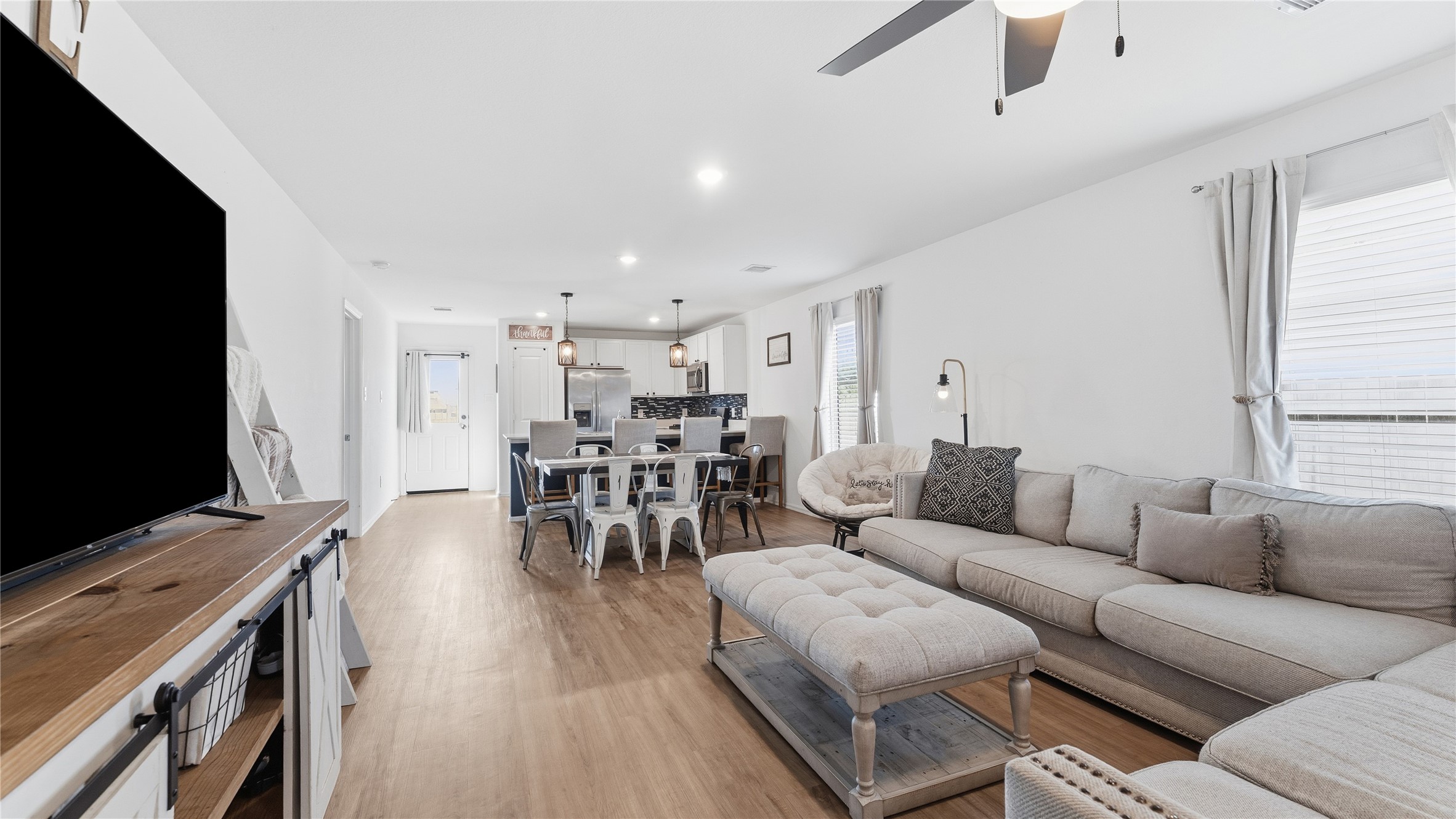 126 Spring Rose Drive Magnolia, TX 77354 - Photo 18 of 48 a living room with furniture and a flat screen tv