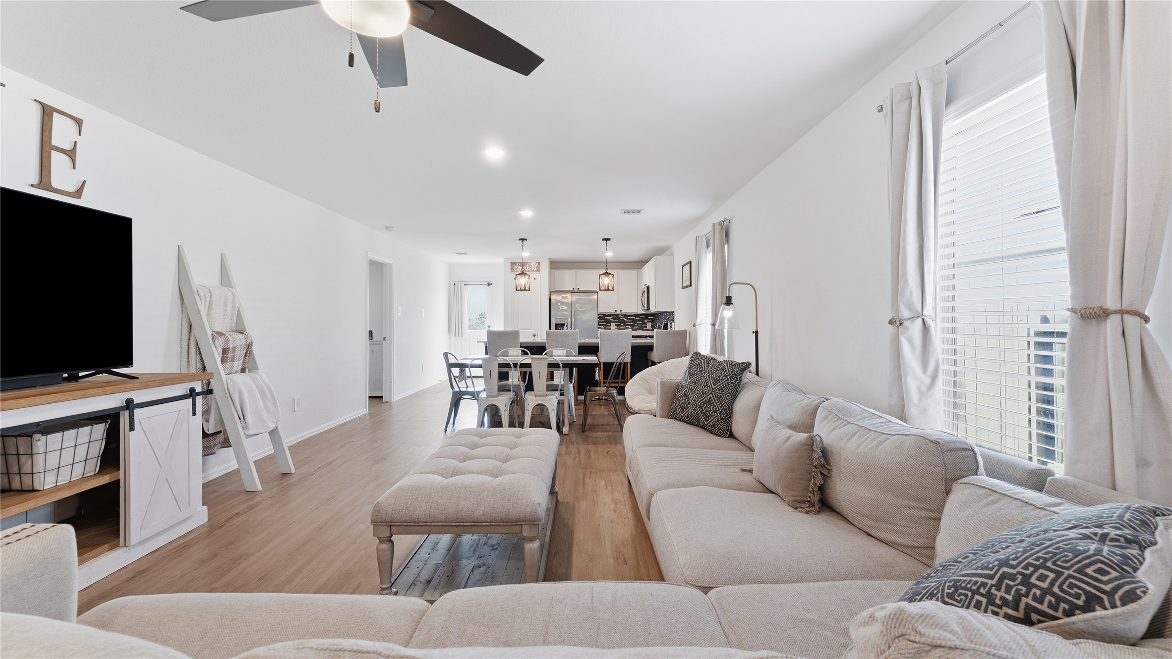 126 Spring Rose Drive Magnolia, TX 77354 - Photo 19 of 48 a living room with furniture and a flat screen tv