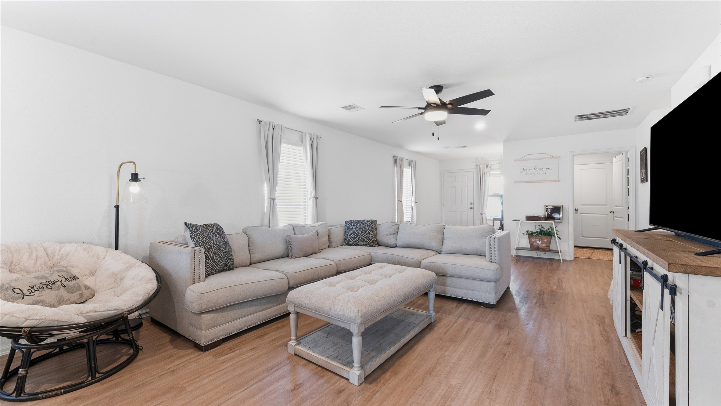126 Spring Rose Drive Magnolia, TX 77354 - Photo 20 of 48 a living room with furniture and a flat screen tv