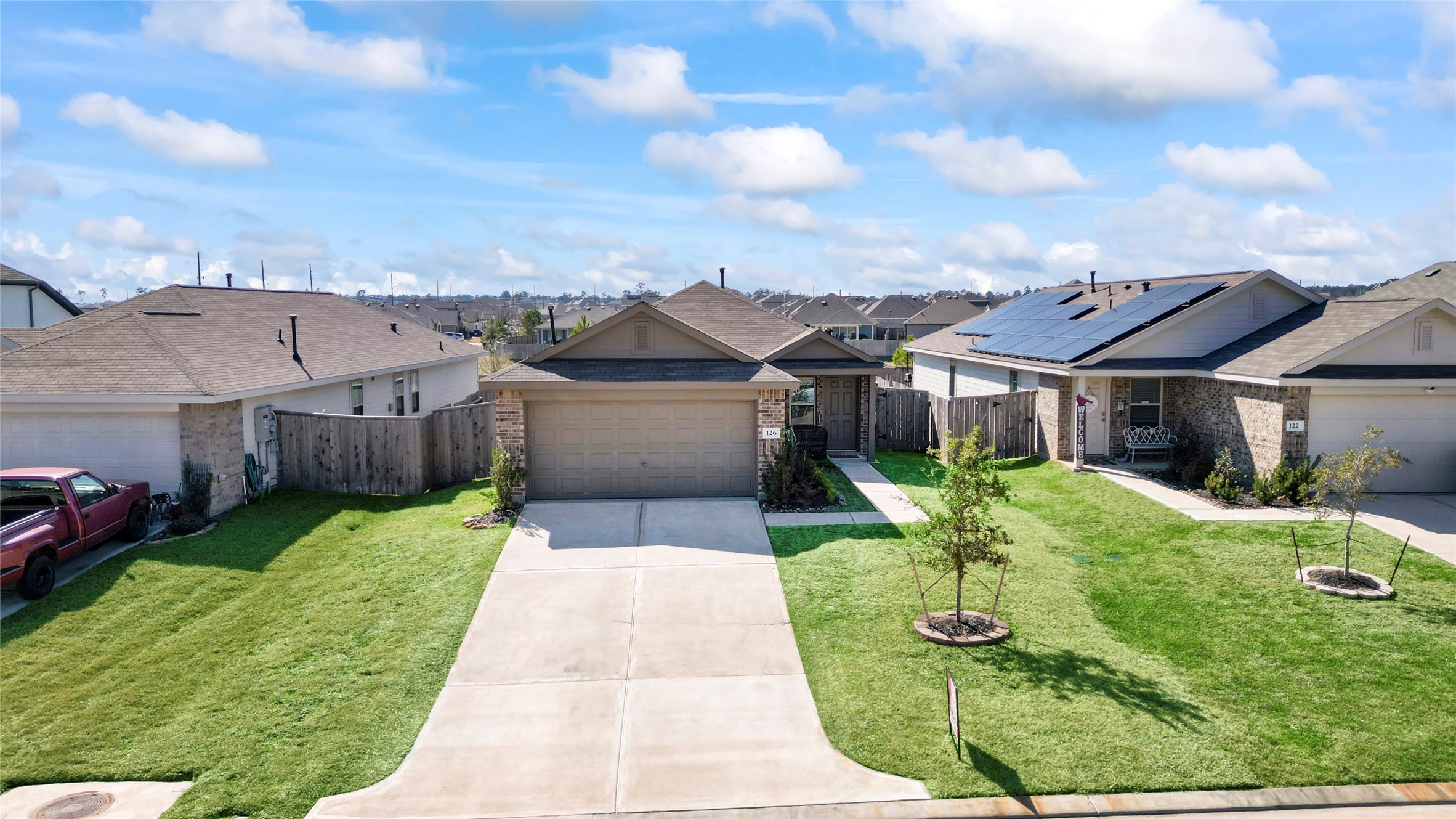 126 Spring Rose Drive Magnolia, TX 77354 - Photo 2 of 48 a front view of house with yard and green space