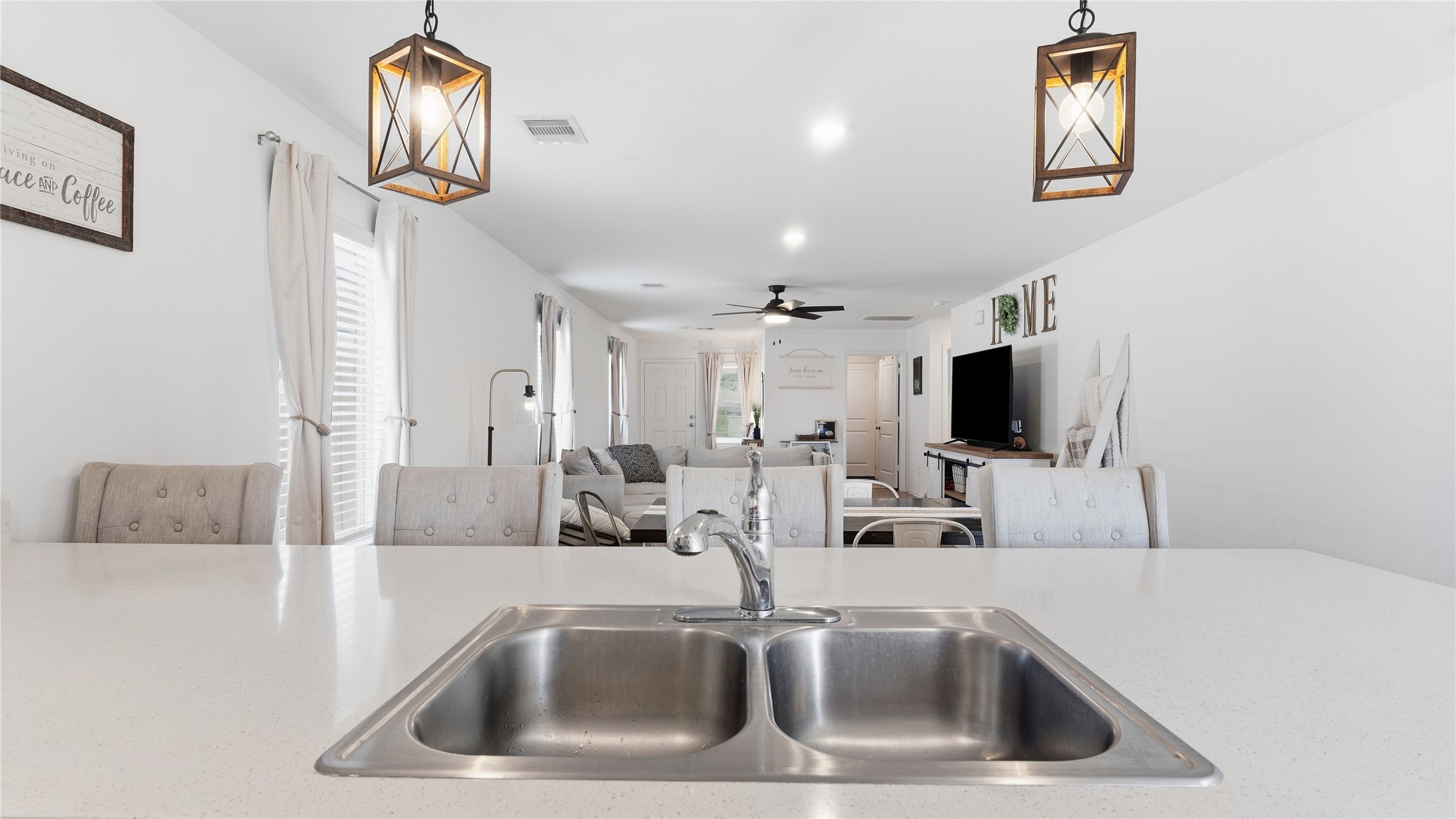 126 Spring Rose Drive Magnolia, TX 77354 - Photo 24 of 48 a kitchen with a sink a counter top space and a lamp