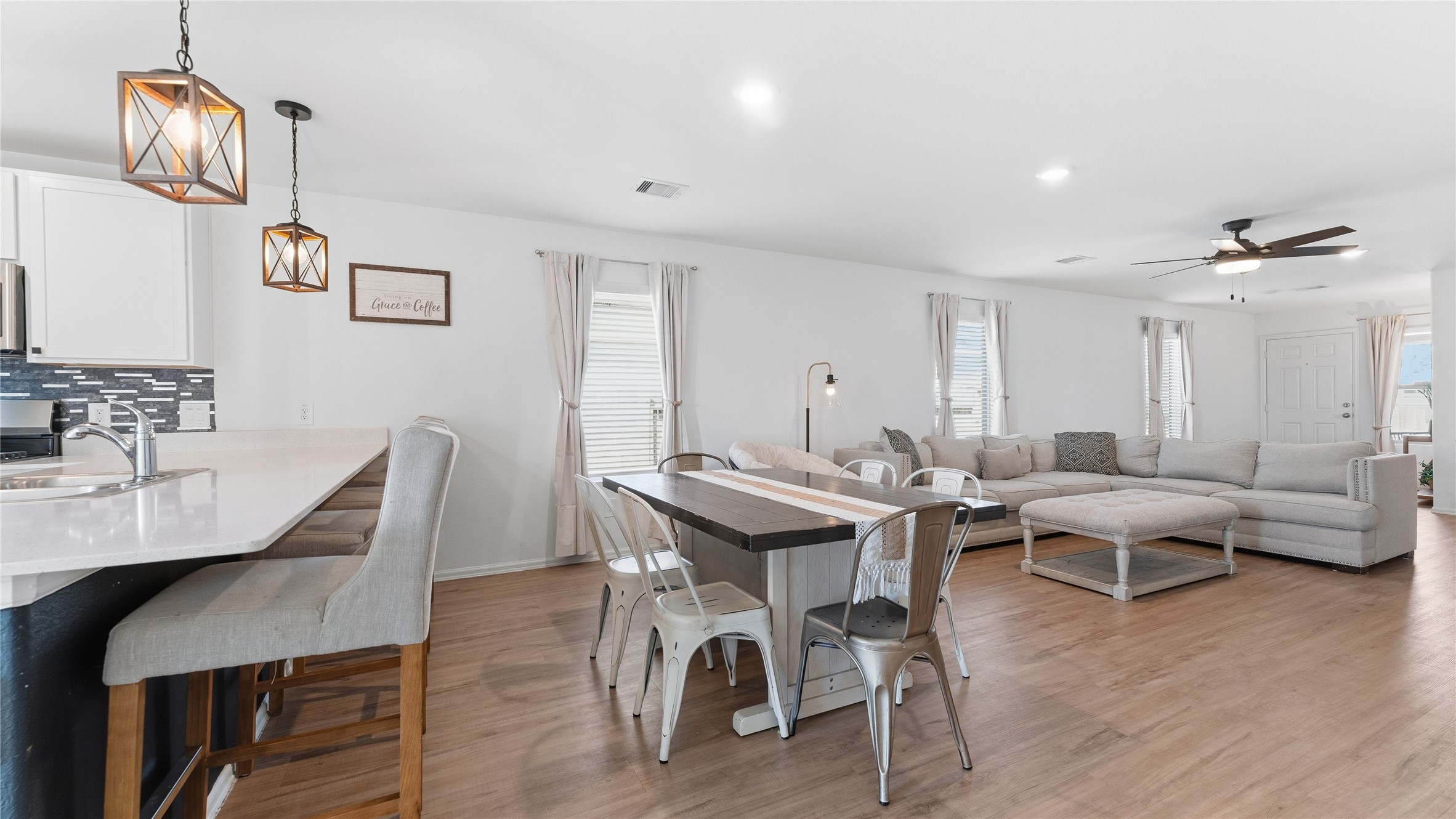 126 Spring Rose Drive Magnolia, TX 77354 - Photo 27 of 48 a view of a dining room with furniture wooden floor and chandelier