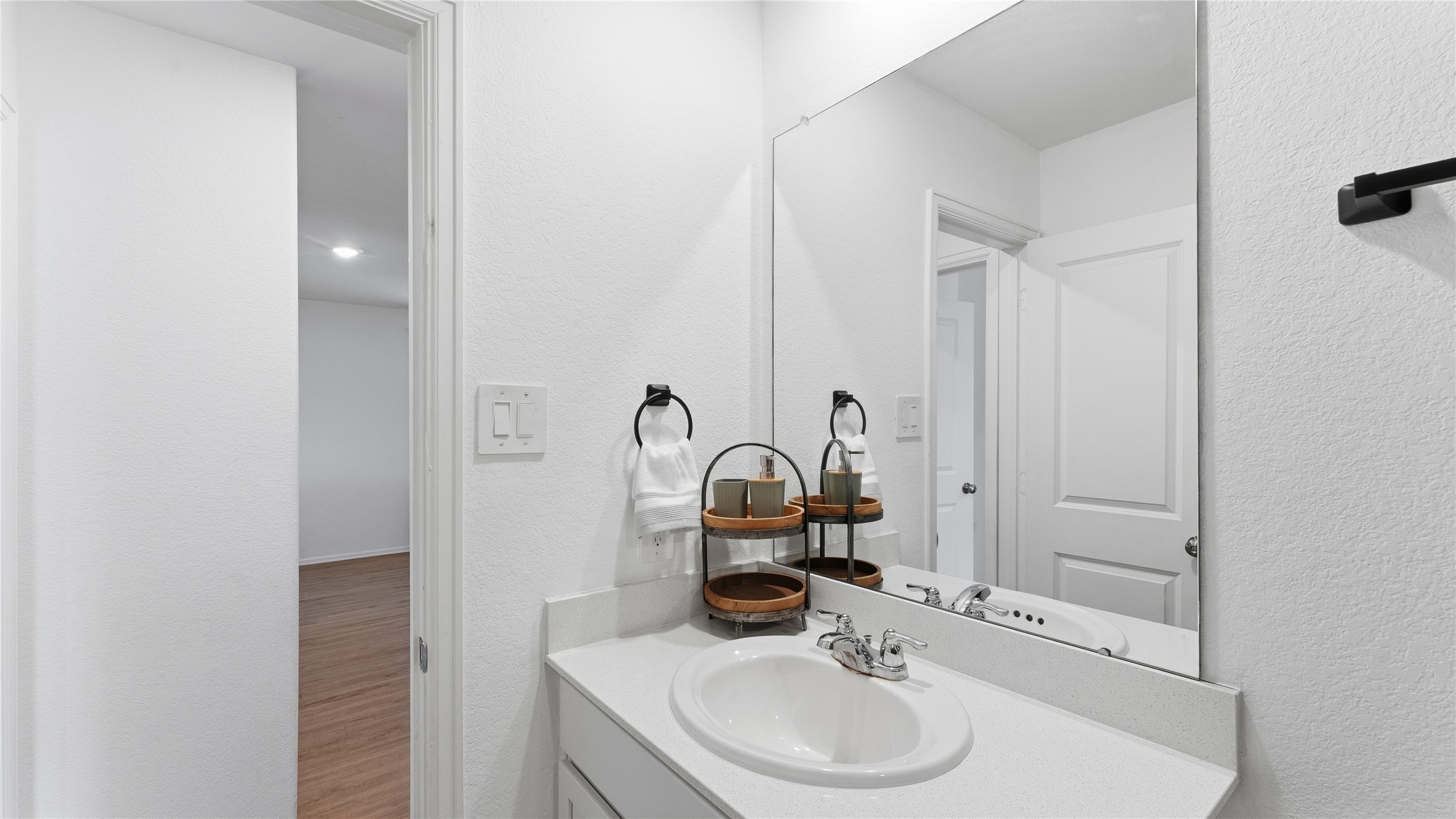 126 Spring Rose Drive Magnolia, TX 77354 - Photo 30 of 48 a bathroom with a sink and a mirror