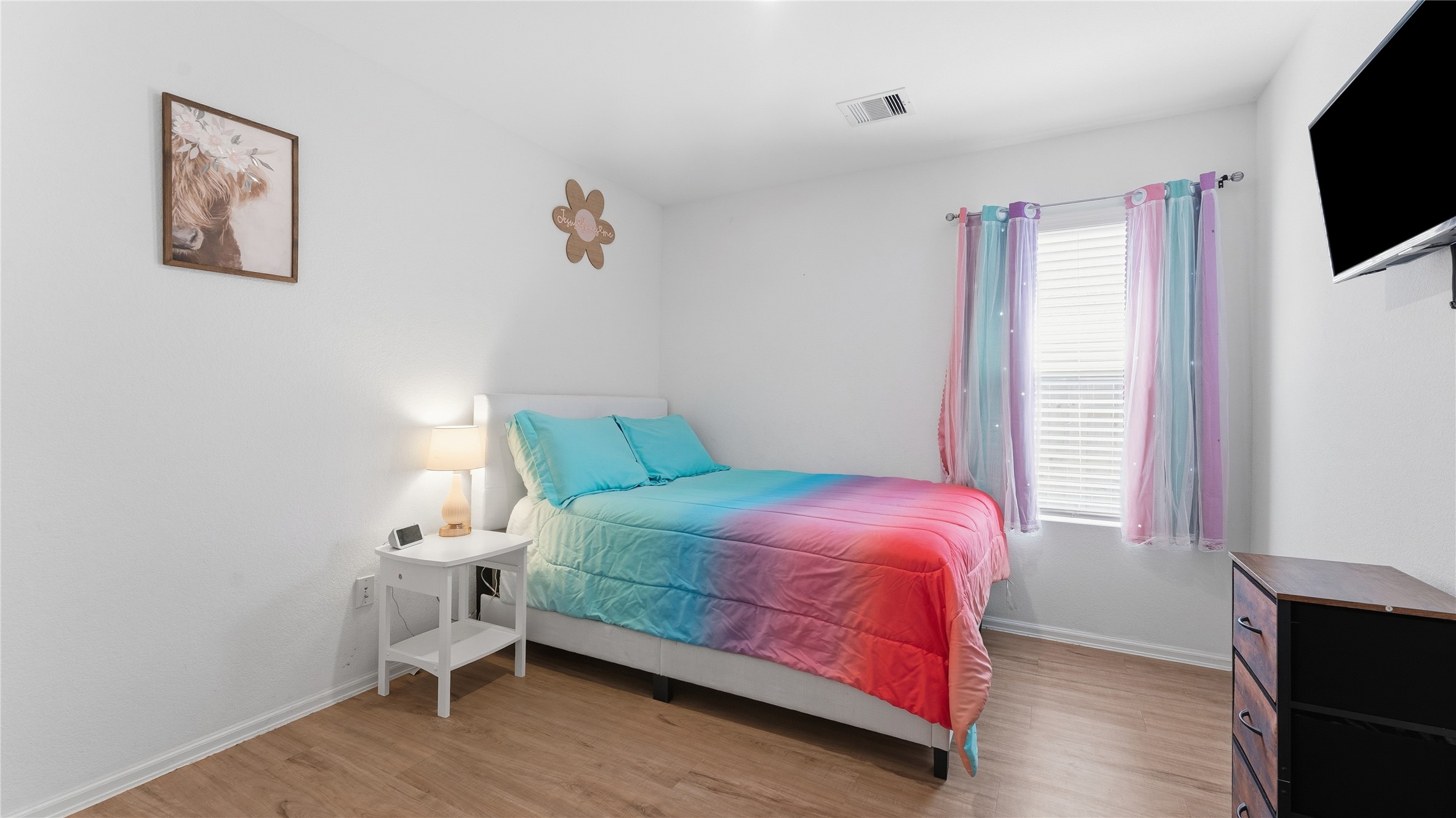 126 Spring Rose Drive Magnolia, TX 77354 - Photo 31 of 48 a bedroom with a bed and a flat screen tv