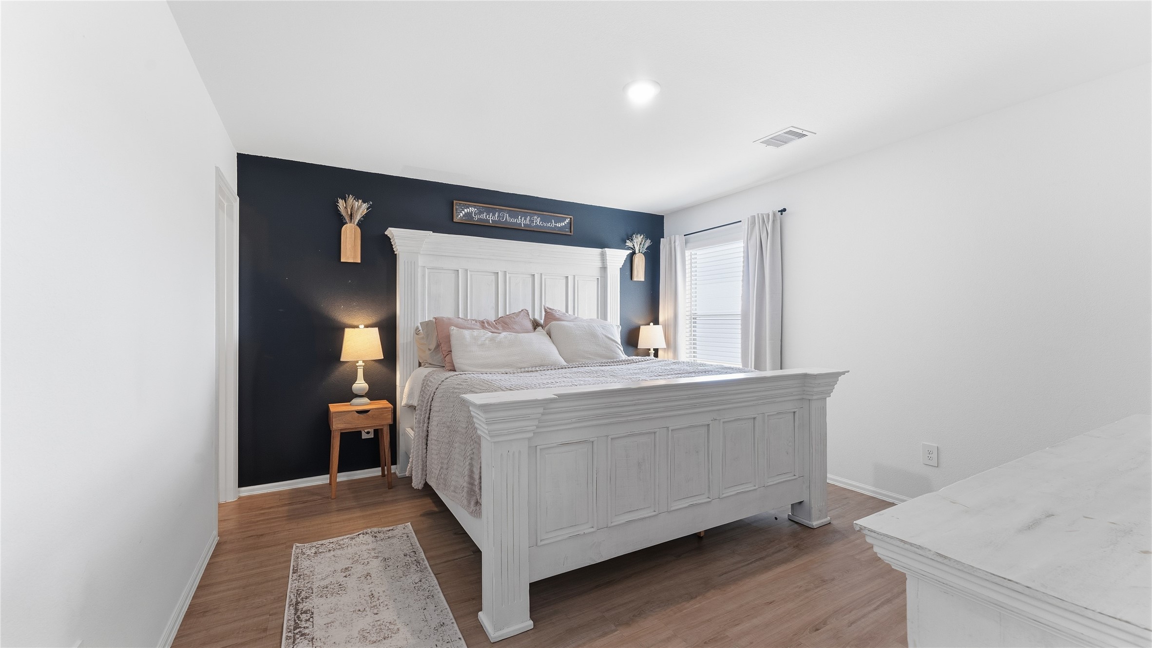 126 Spring Rose Drive Magnolia, TX 77354 - Photo 36 of 48 a room with a bed and a mirror