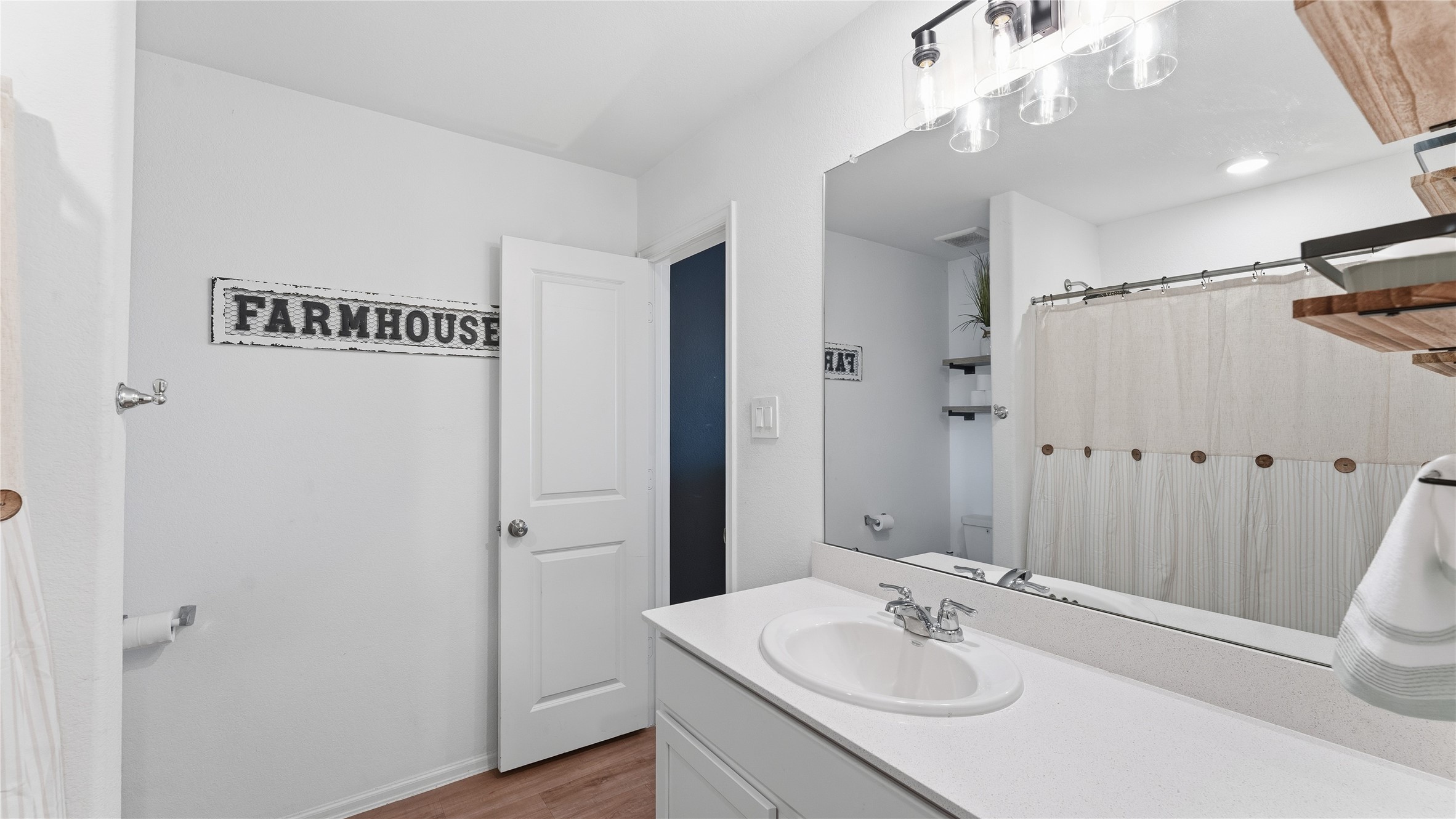 126 Spring Rose Drive Magnolia, TX 77354 - Photo 40 of 48 a bathroom with a sink a mirror and a shower