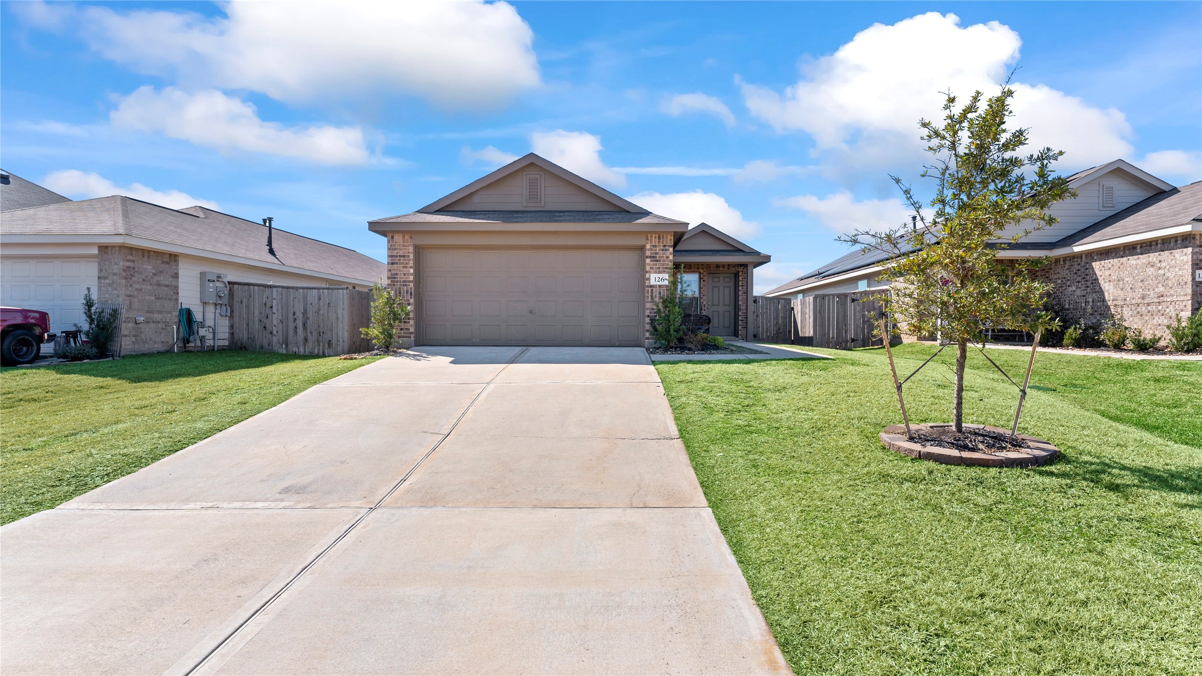 126 Spring Rose Drive Magnolia, TX 77354 - Photo 4 of 48 a front view of a house with a yard