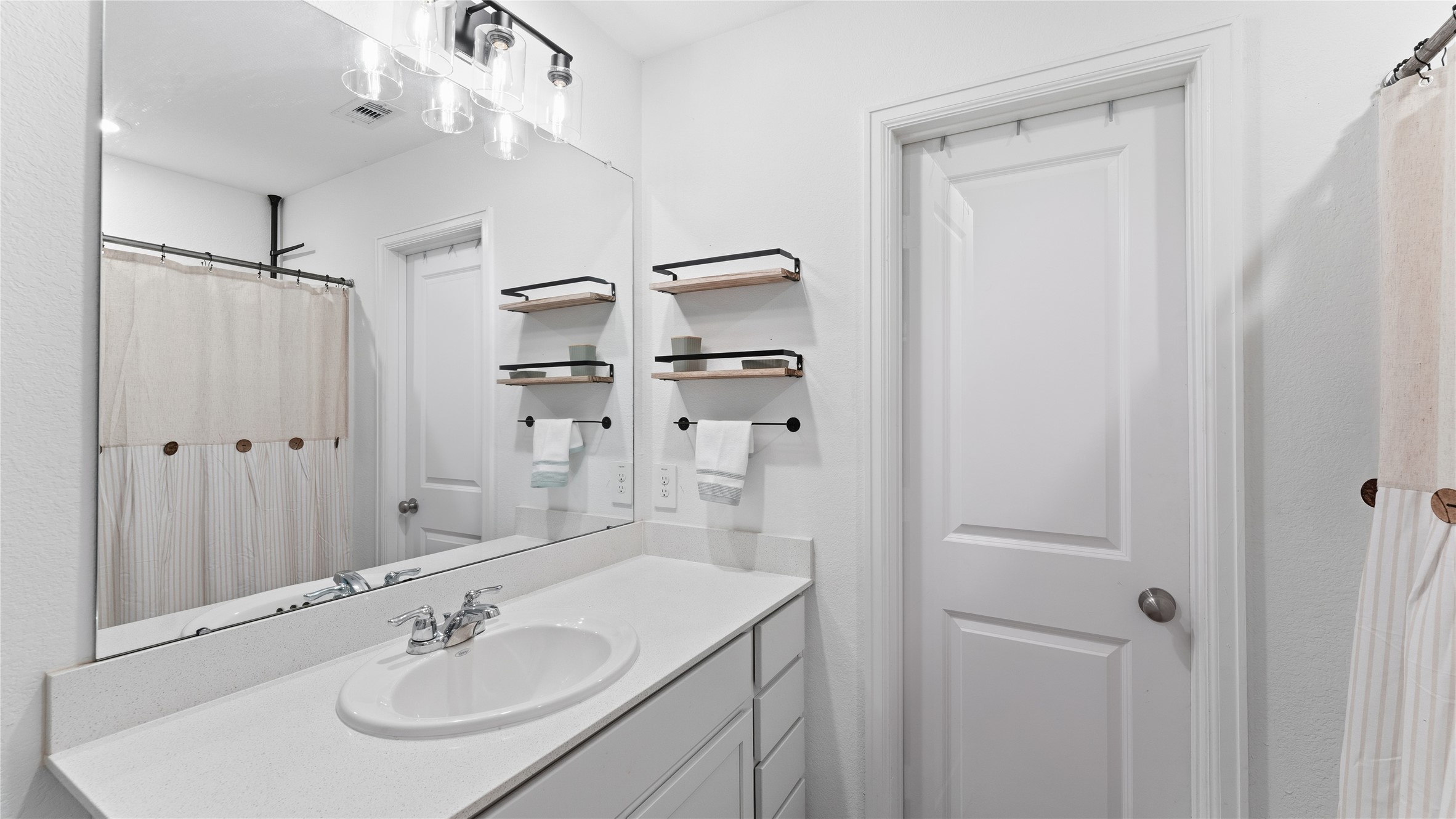 126 Spring Rose Drive Magnolia, TX 77354 - Photo 41 of 48 a bathroom with a sink double vanity and a mirror