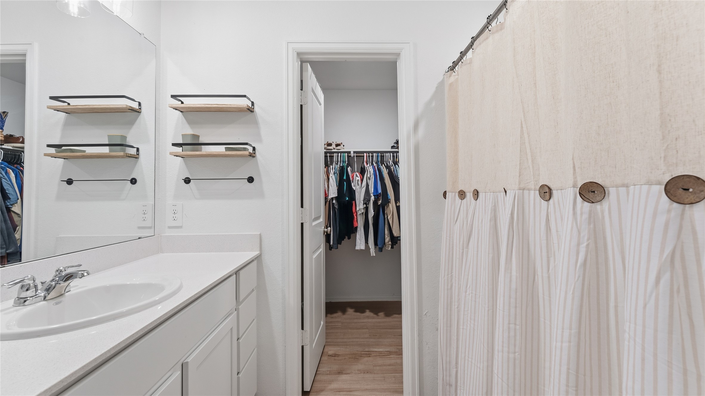 126 Spring Rose Drive Magnolia, TX 77354 - Photo 42 of 48 a bathroom with a sink and a mirror