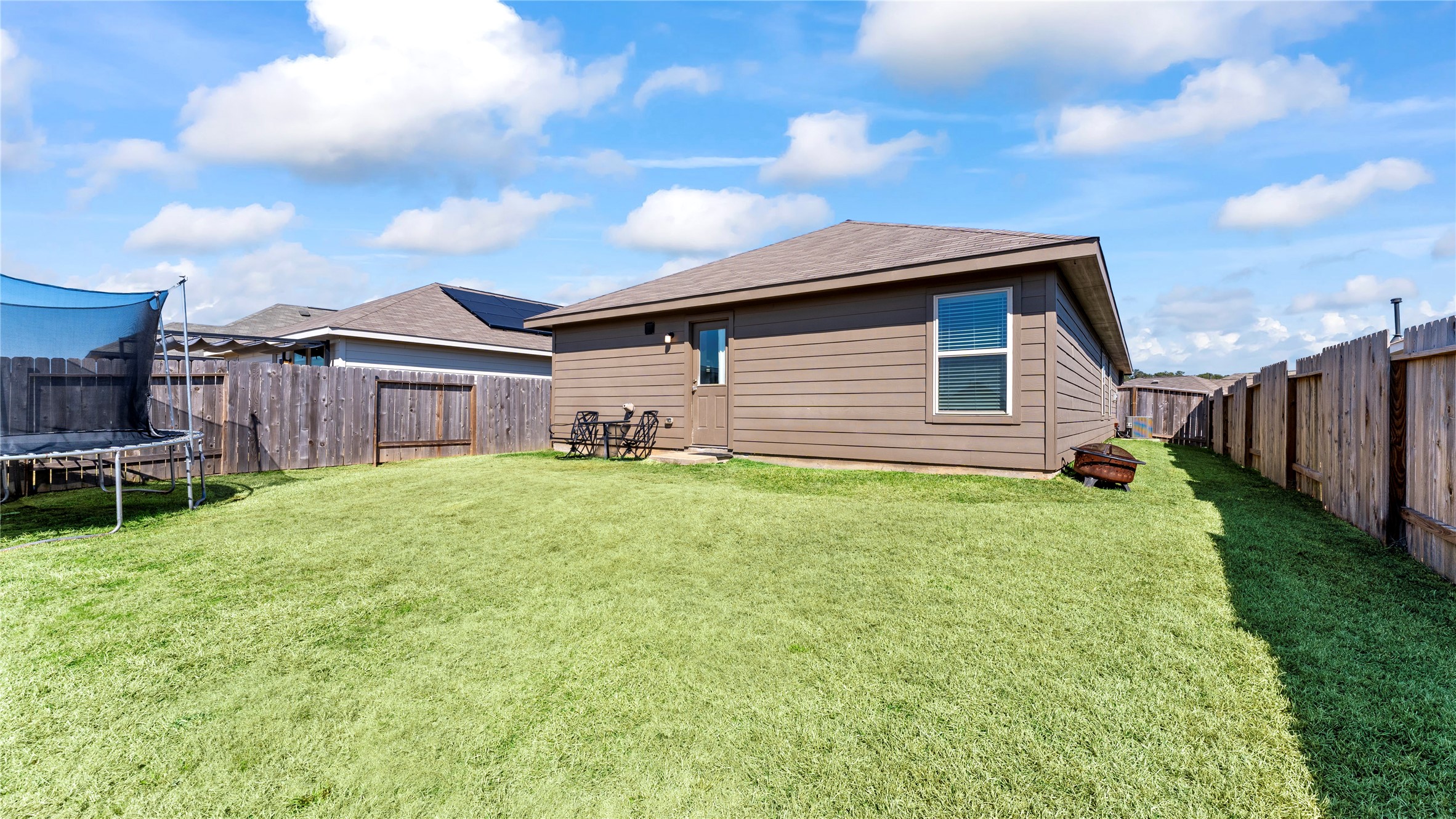 126 Spring Rose Drive Magnolia, TX 77354 - Photo 46 of 48 a front view of a house with a garden
