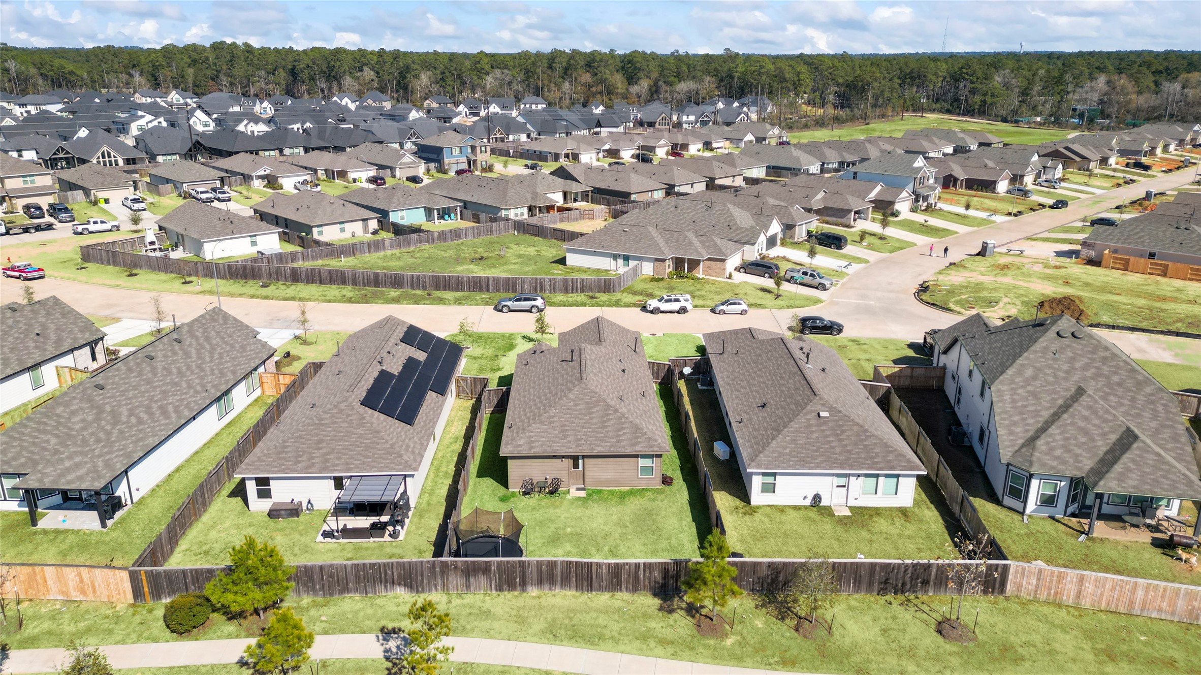 126 Spring Rose Drive Magnolia, TX 77354 - Photo 48 of 48 an aerial view of residential houses with outdoor space and parking